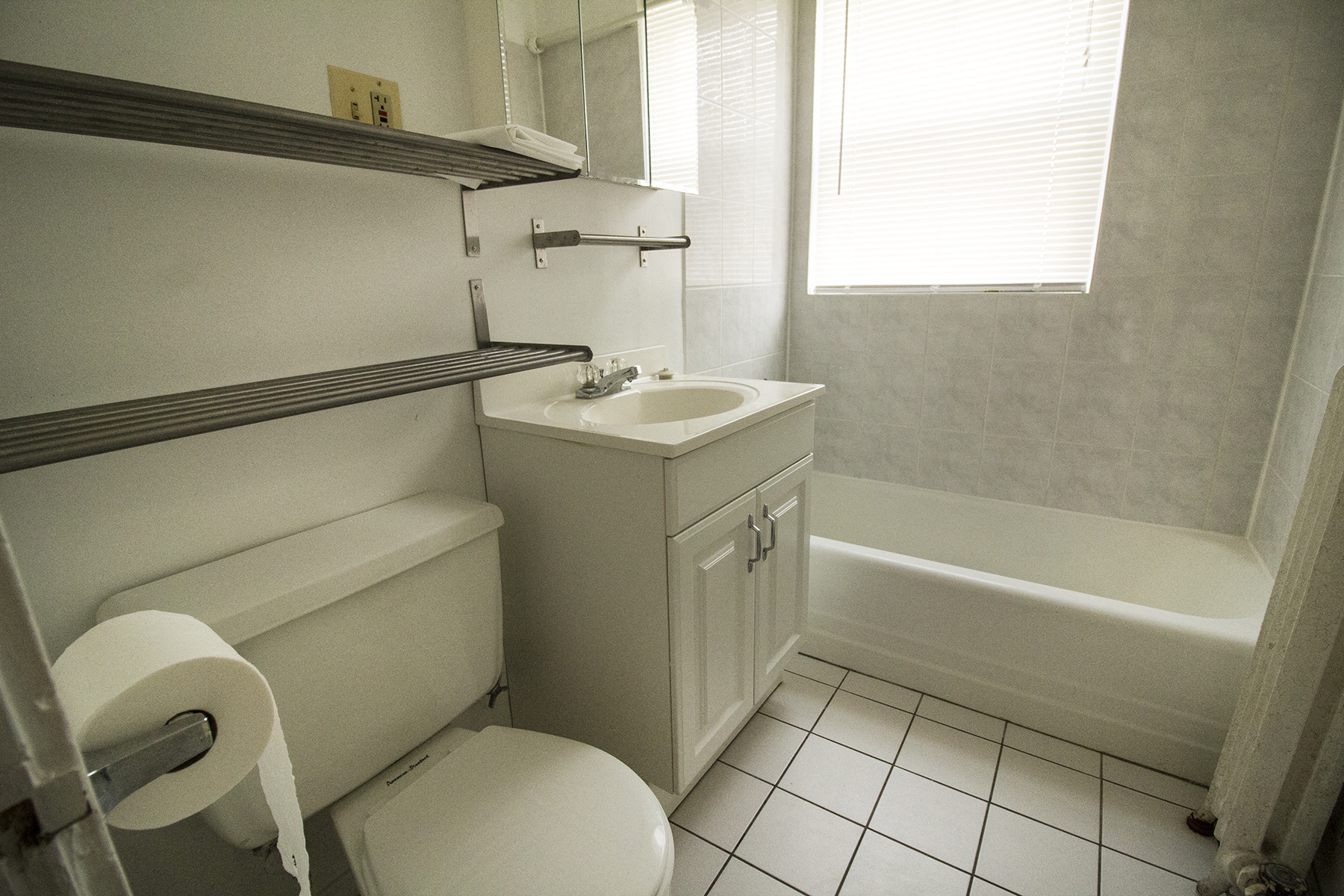 a bathroom with a sink toilet and a bath tub