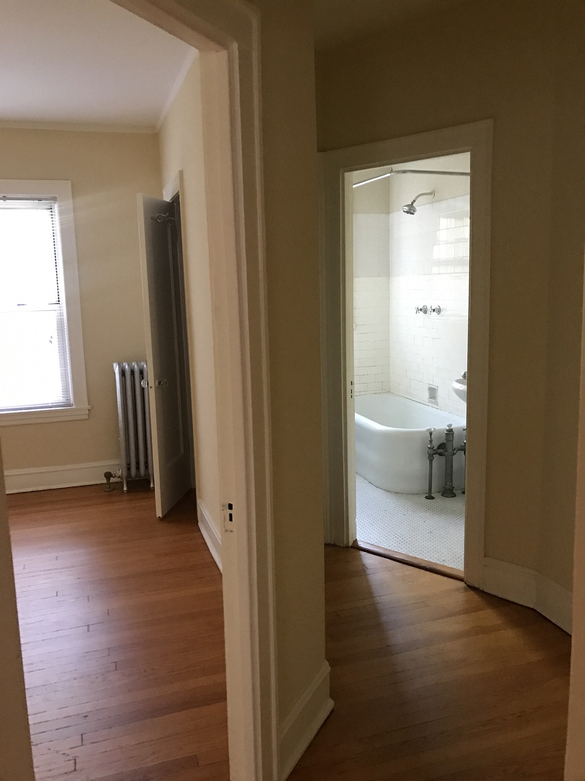 a view of the bathroom from the living room with the door open