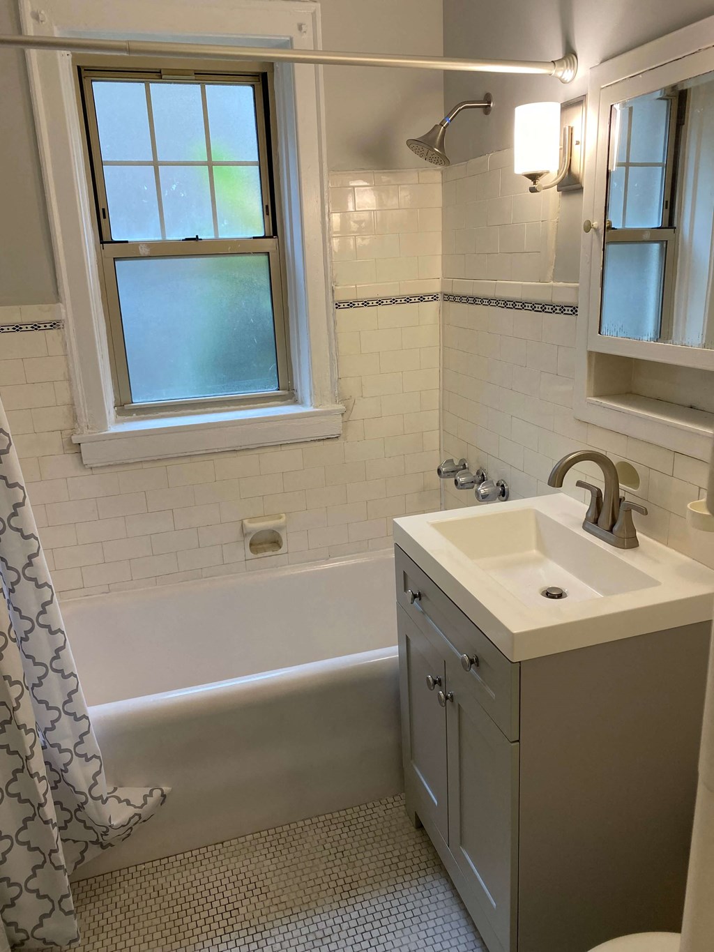 a bathroom with a sink and a bath tub