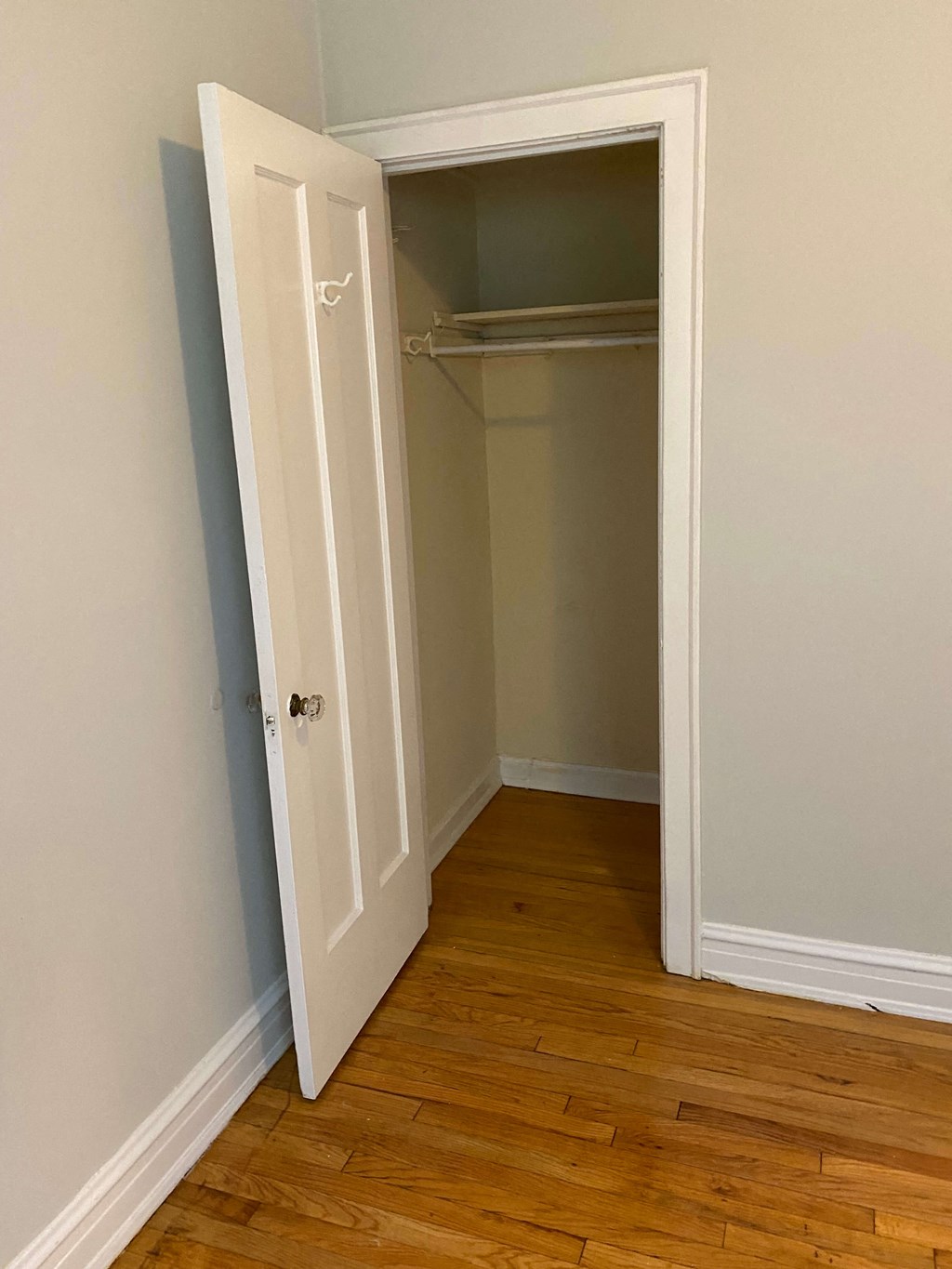 a room with a closet and a door open