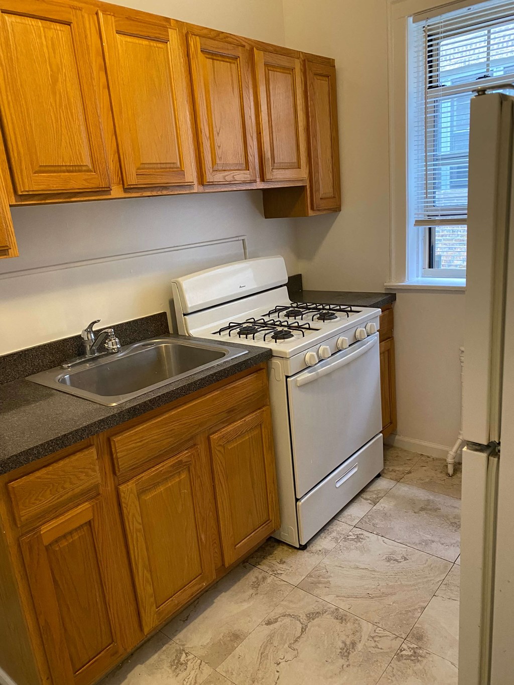 a kitchen with a stove and a sink