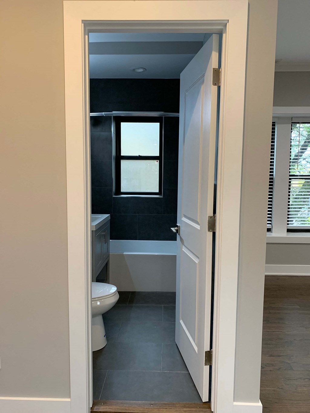 a view of a bathroom with a toilet and a window