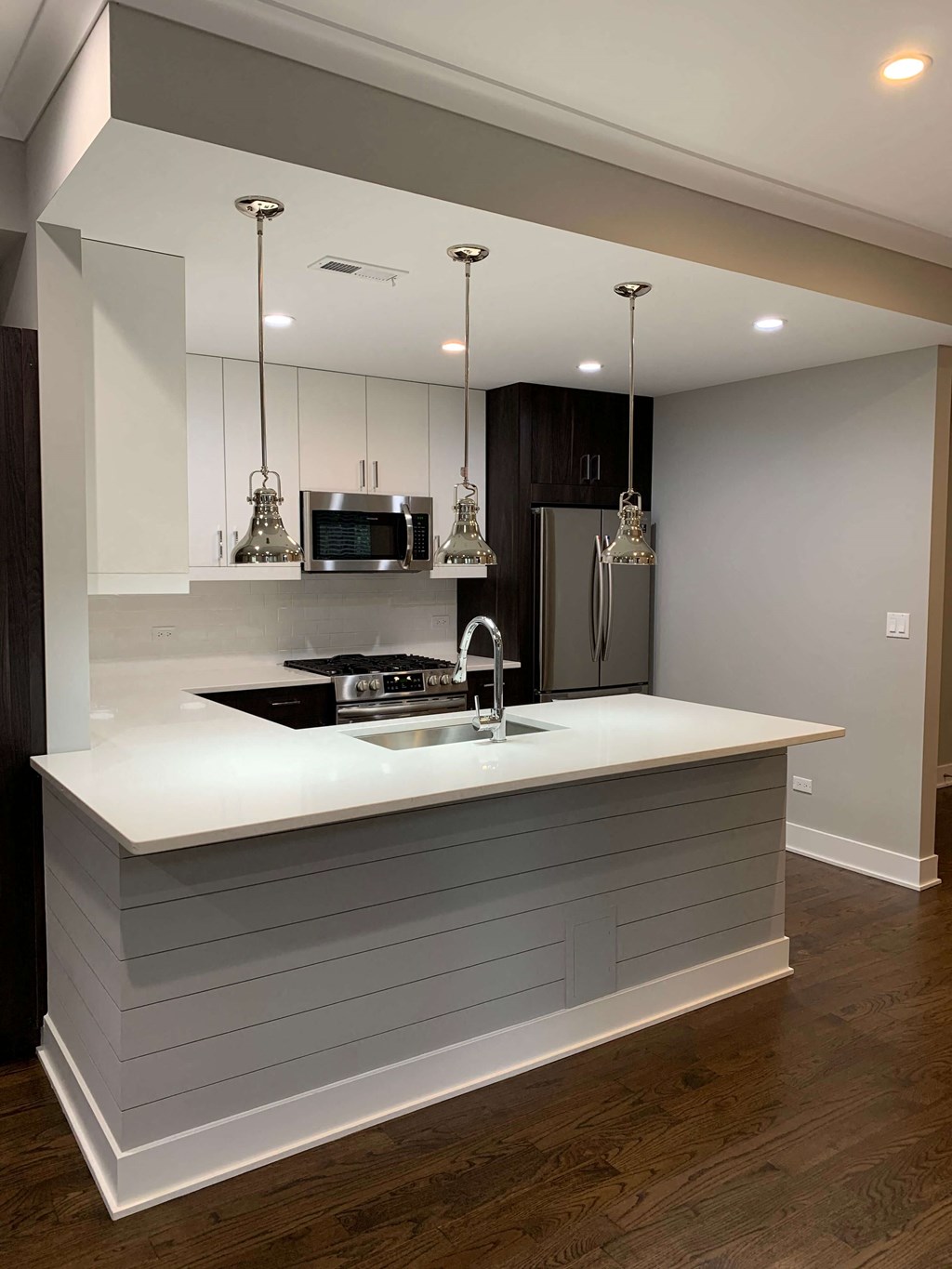 a kitchen with a counter top and a sink