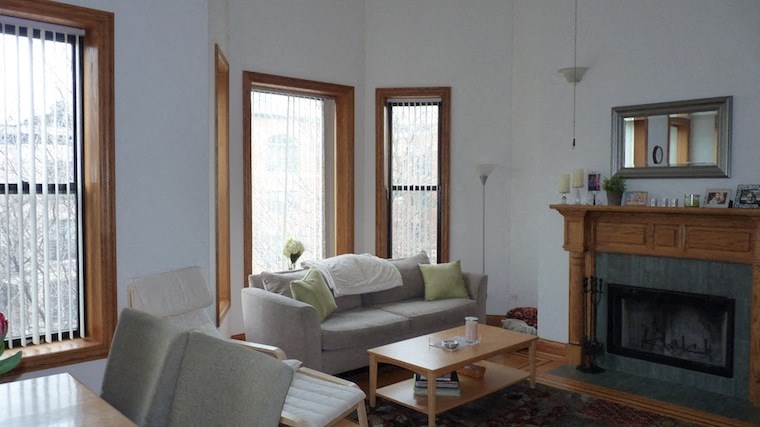 a living room with a couch and a fireplace