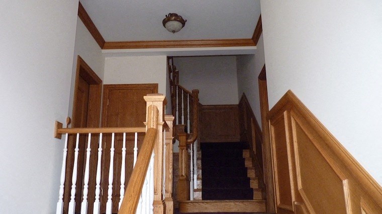a view from the top of a wooden staircase