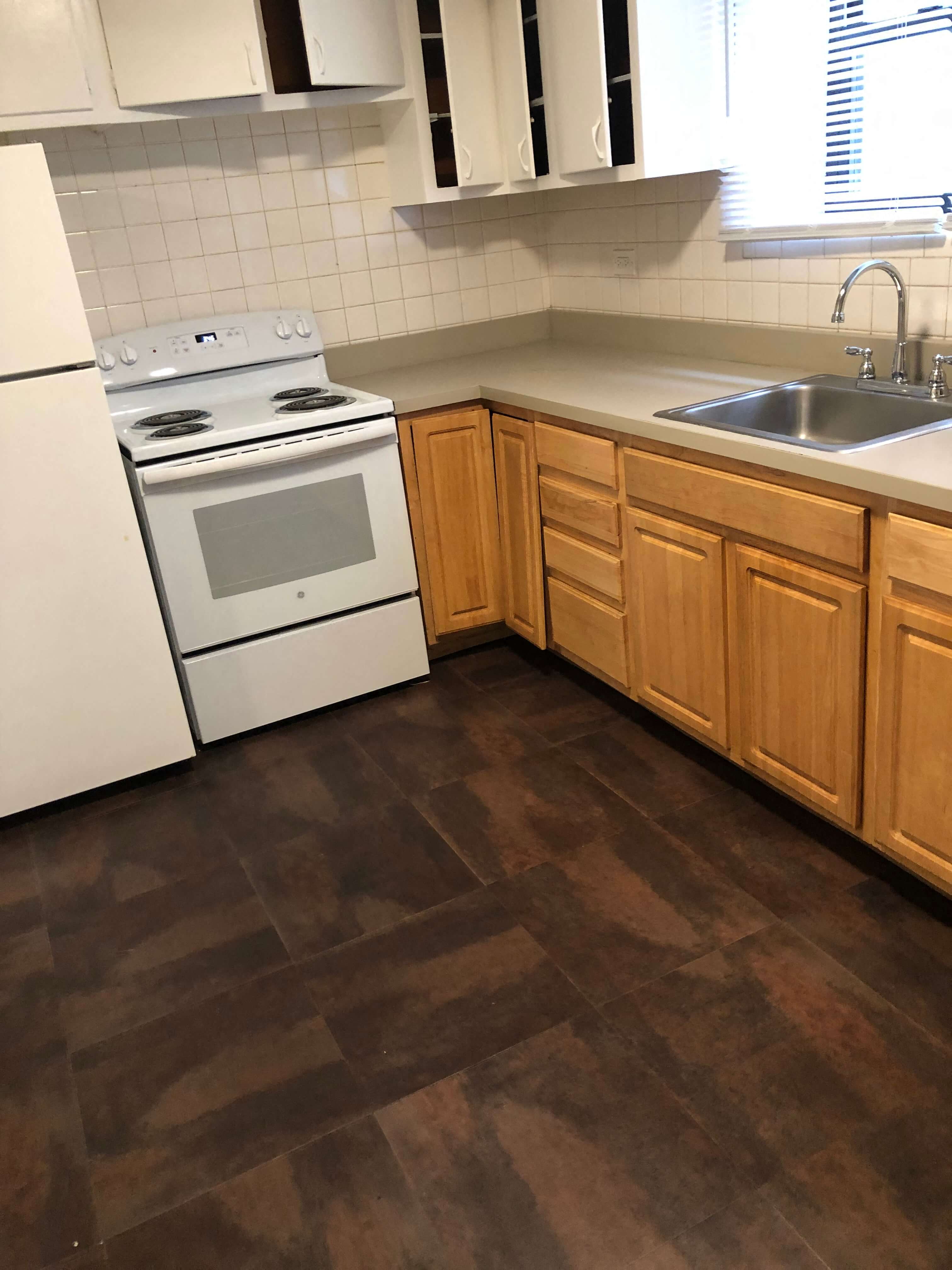 a kitchen with a stove and a sink