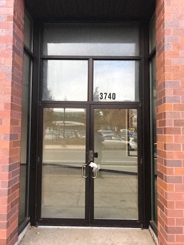 A glass door with a handle and a number 3740 on it.