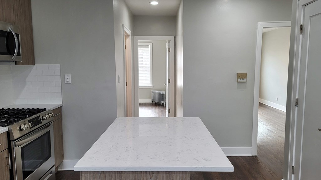 a kitchen with a large island in the middle of it