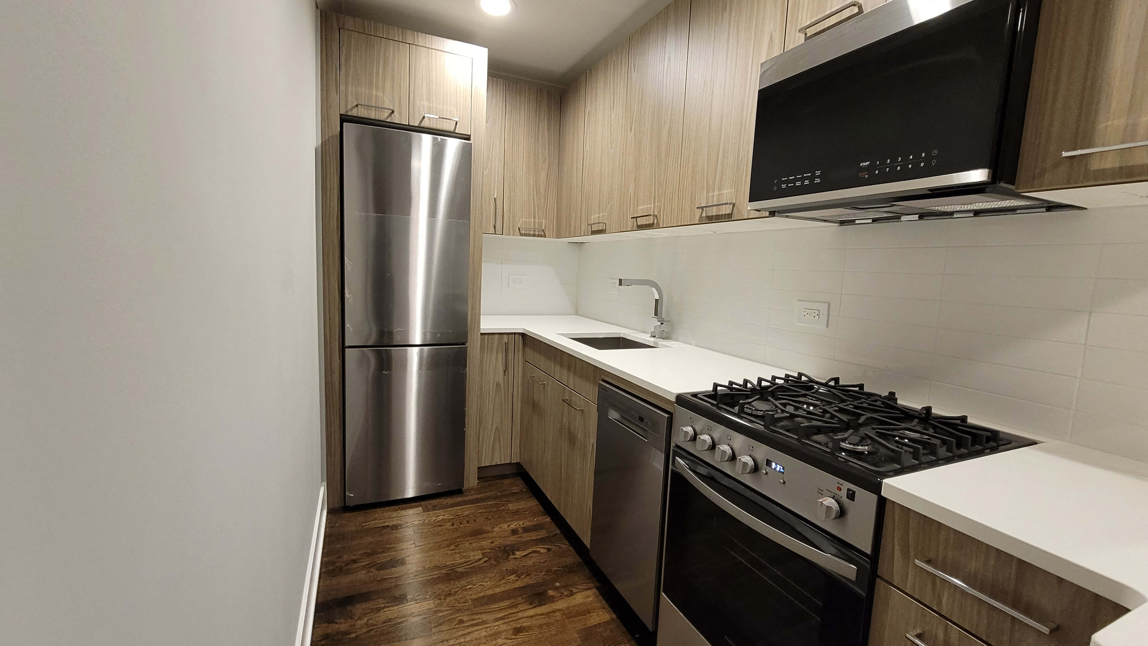 a kitchen with a stove and a refrigerator