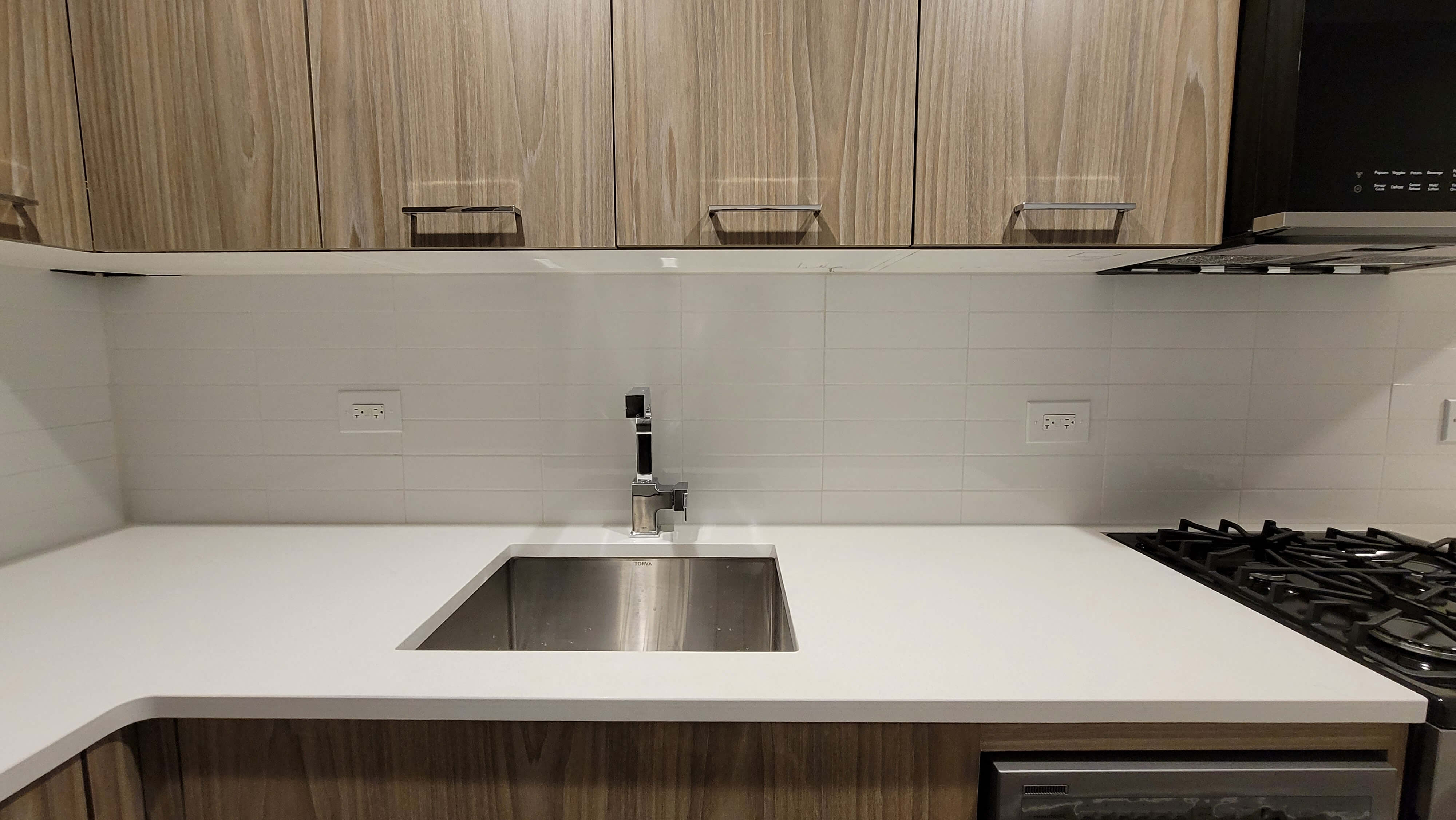 a kitchen with a sink and a counter top