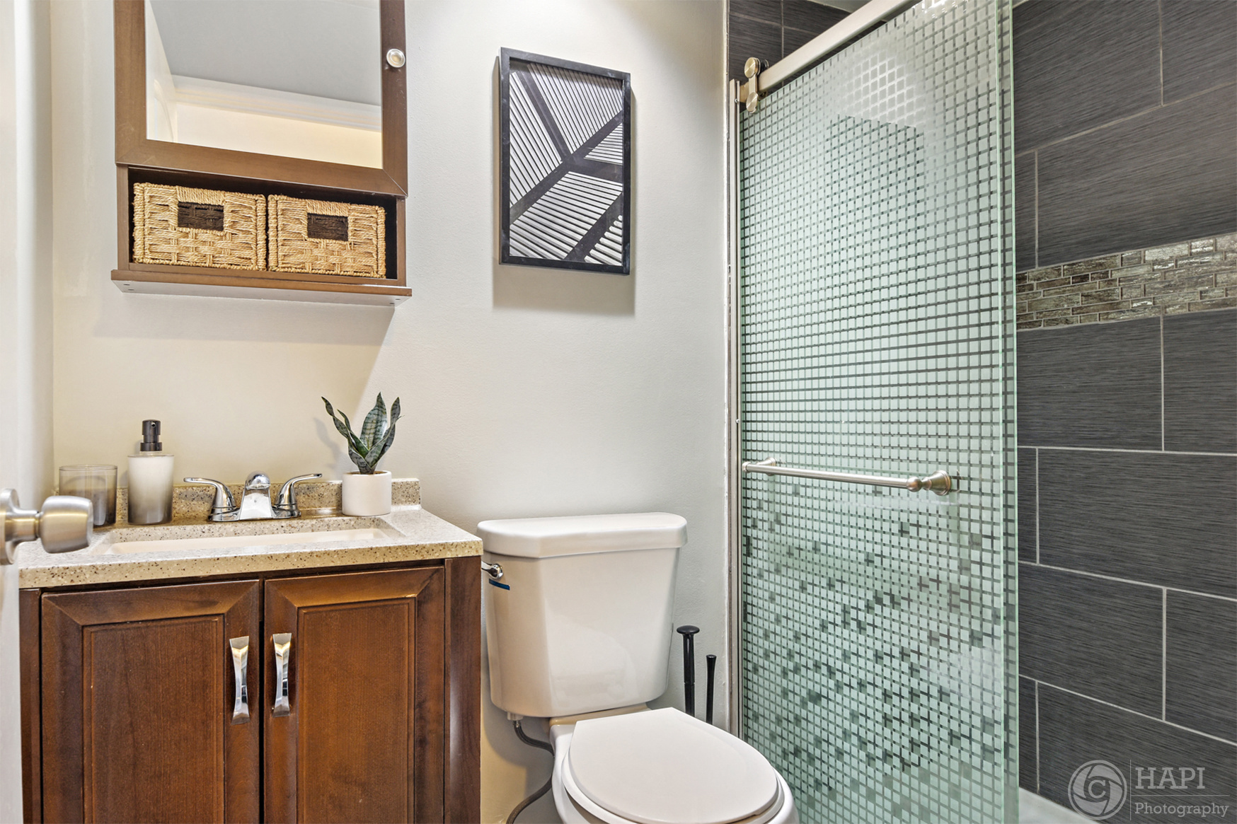a bathroom with a shower toilet and sink