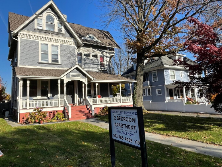 a house with a sign in front of it