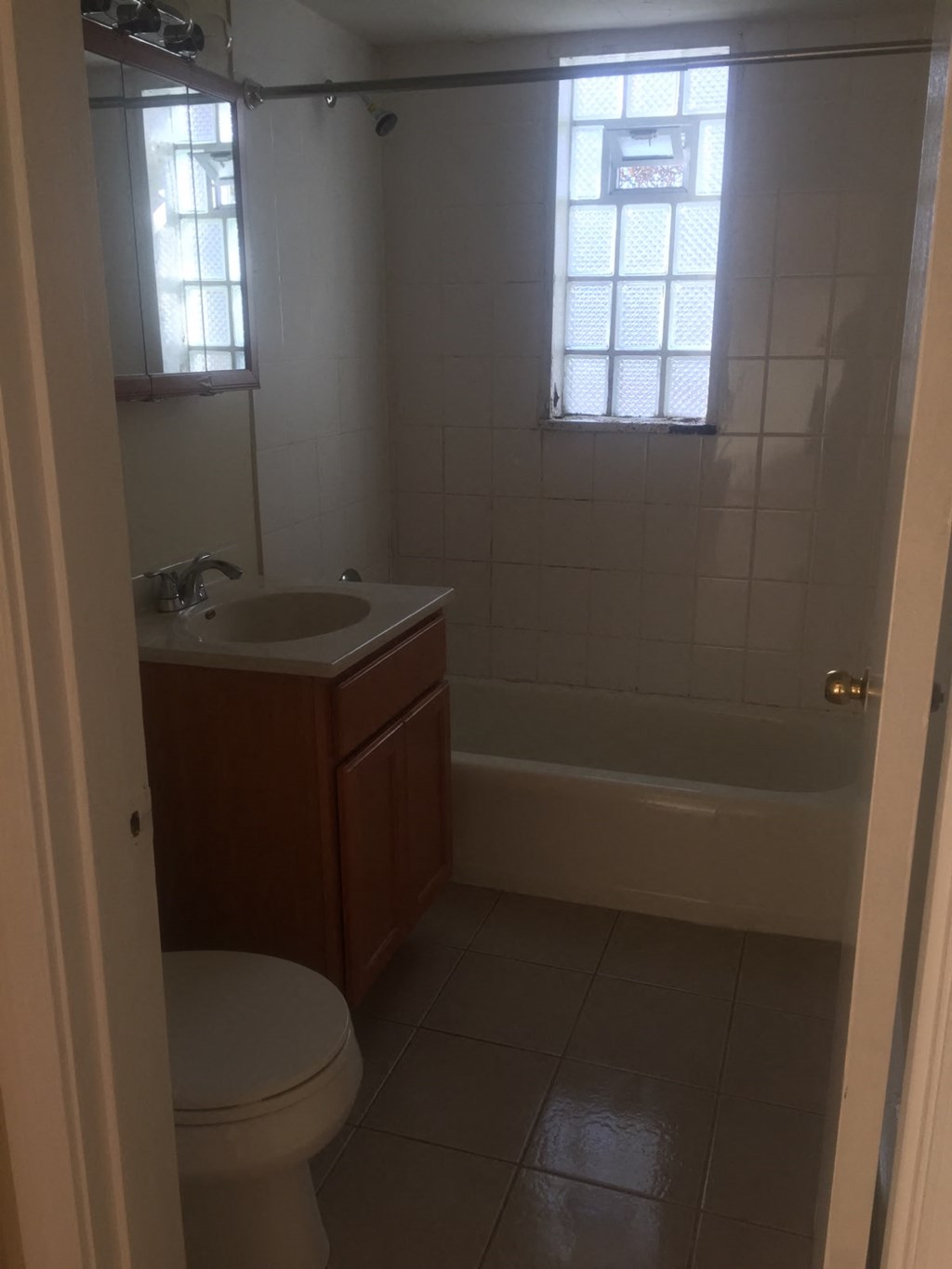 a bathroom with a sink toilet and a tub