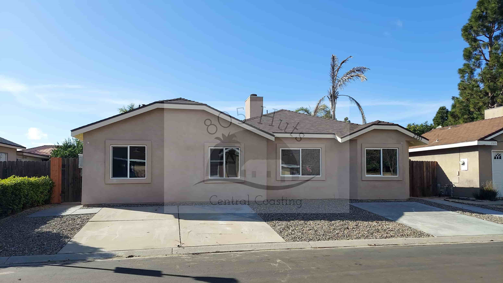 A beige house with the words Central Coastline on the side.