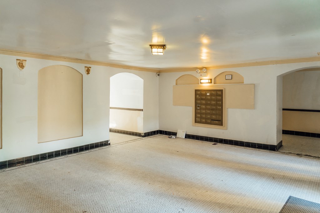 a large room with a carpeted floor and a sign on the wall