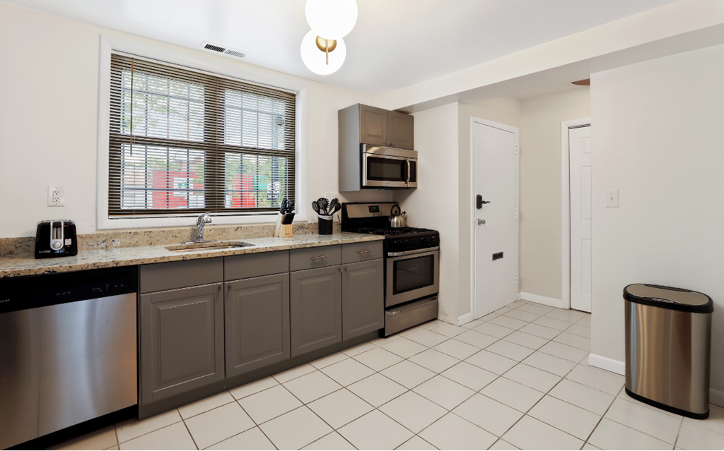 a kitchen with stainless steel appliances and granite counter tops