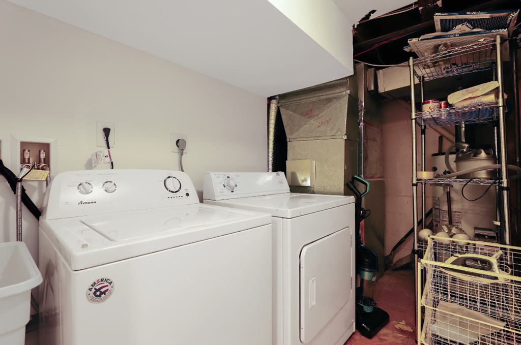 a laundry room with two washes and a dryer in it