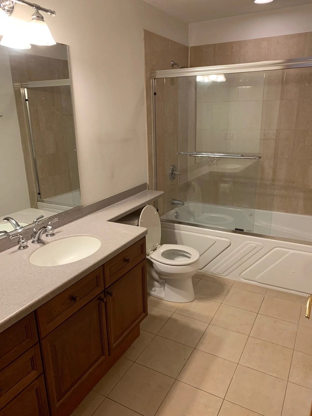 a bathroom with a sink toilet and a shower