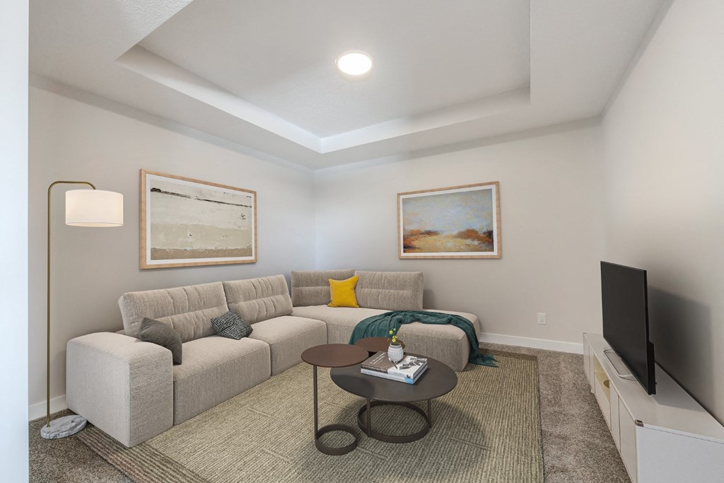 a living room with a couch and a tv