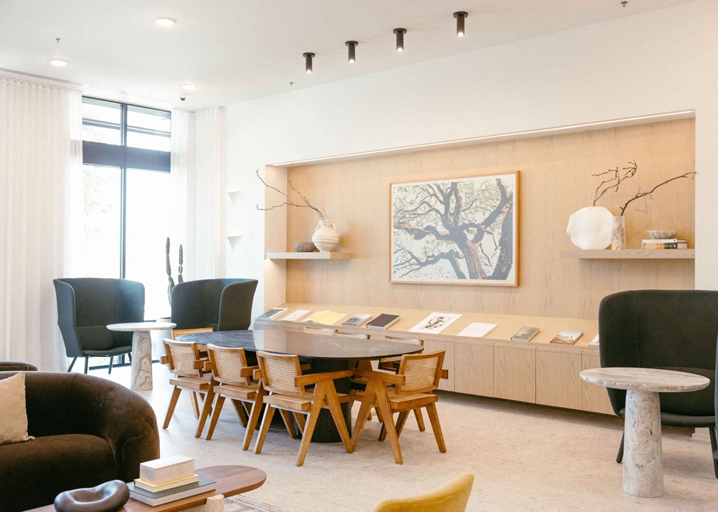 a dining room with a table and chairs