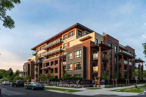 a rendering of an apartment building on a city street
