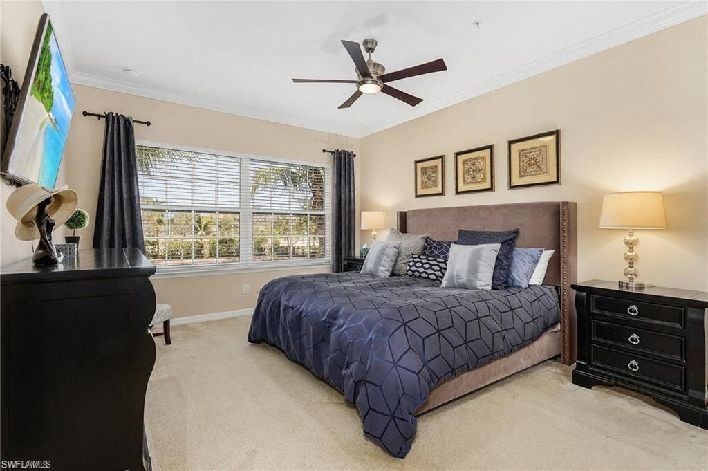 a bedroom with a bed and a ceiling fan
