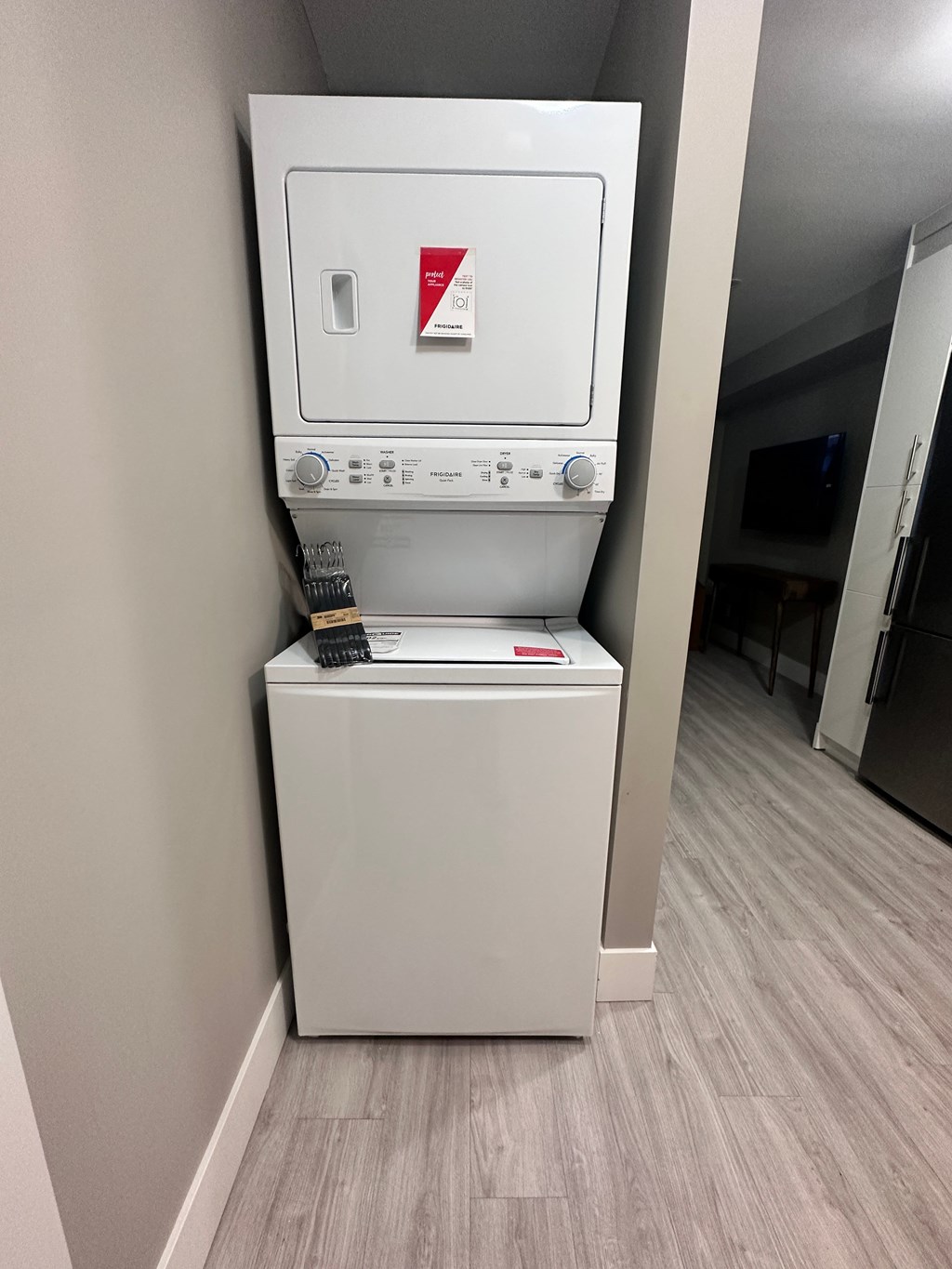 a washer and dryer in the corner of a room