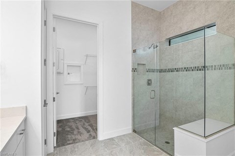 a bathroom with a shower and a sink