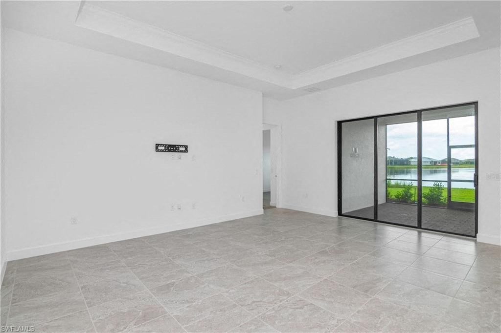 the living room has a large glass door to the patio