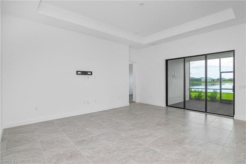 the living room has a large glass door to the patio