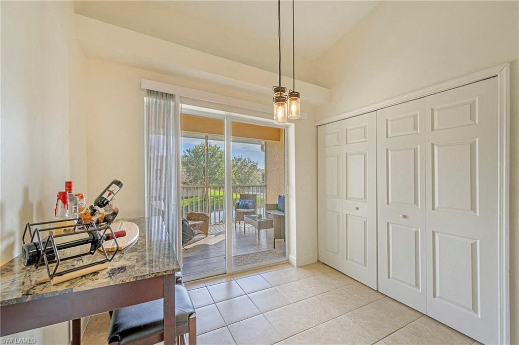 a kitchen with a counter and a door to a patio
