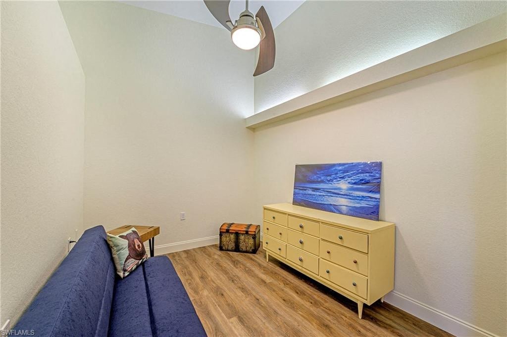 a living room with a couch and a dresser