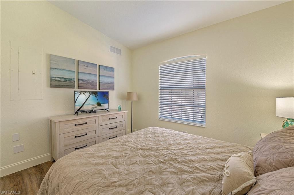 a bedroom with a bed and a dresser