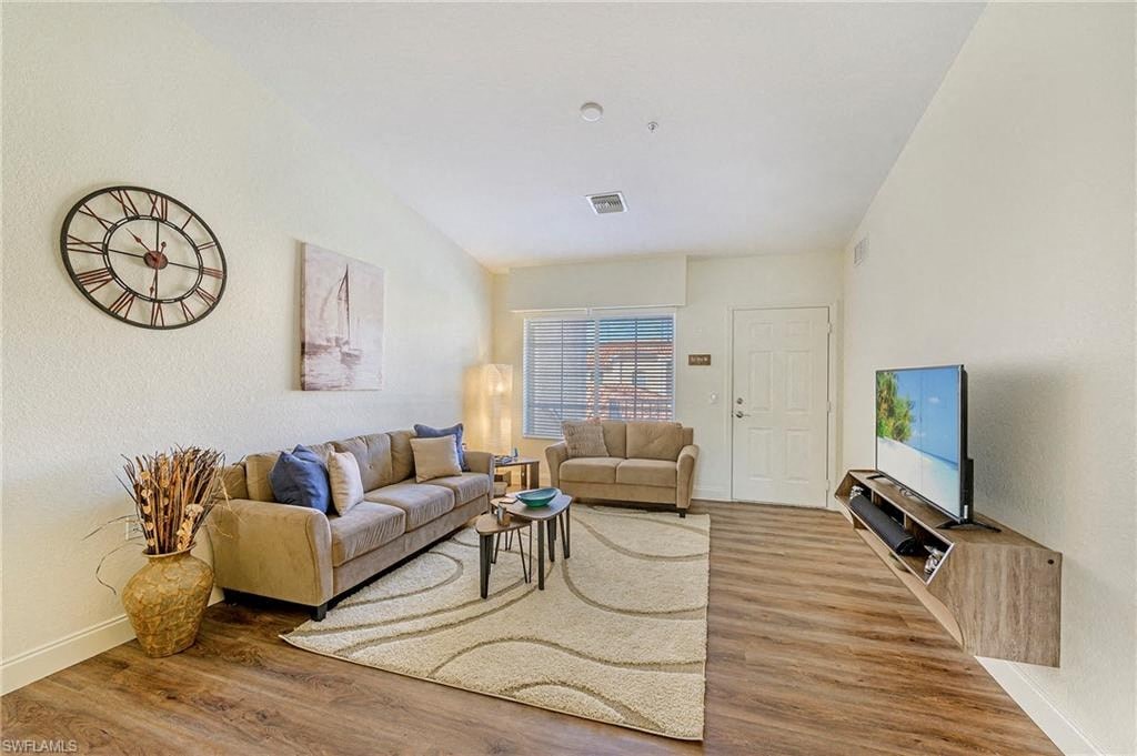 a living room with a couch and a tv