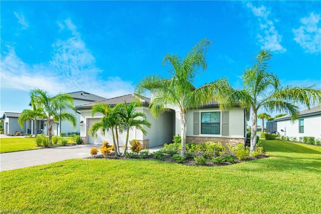 a house with palm trees in front of it