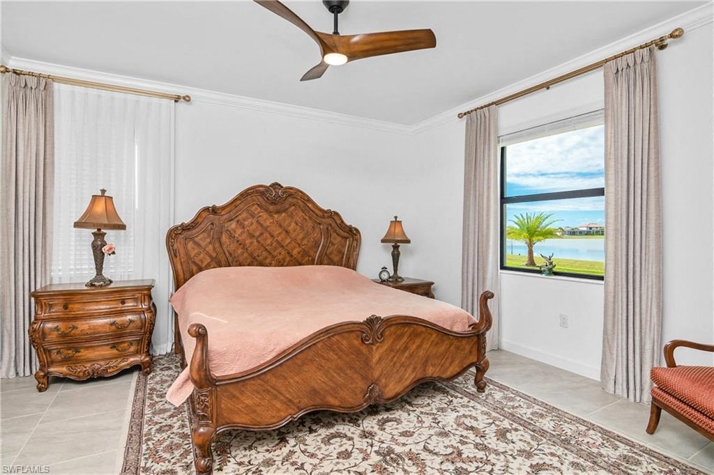 a bedroom with a bed and a ceiling fan