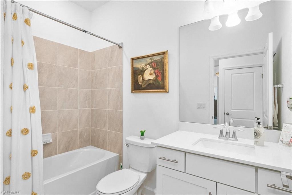 a bathroom with a sink toilet and a bath tub