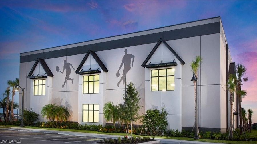 the facade of a building with shadows of people on it