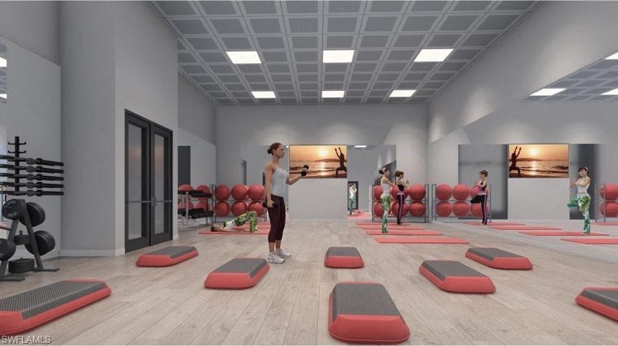 a group of people in a gym with exercise equipment