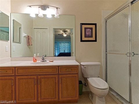 a bathroom with a sink toilet and a shower