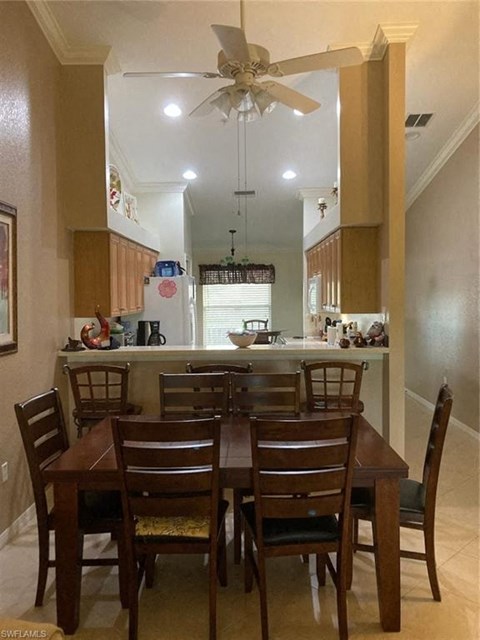 a dining room table and chairs in a kitchen