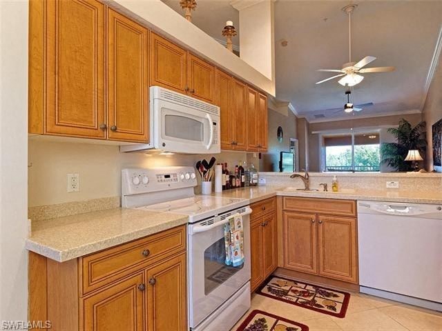 a large kitchen with a stove microwave and sink