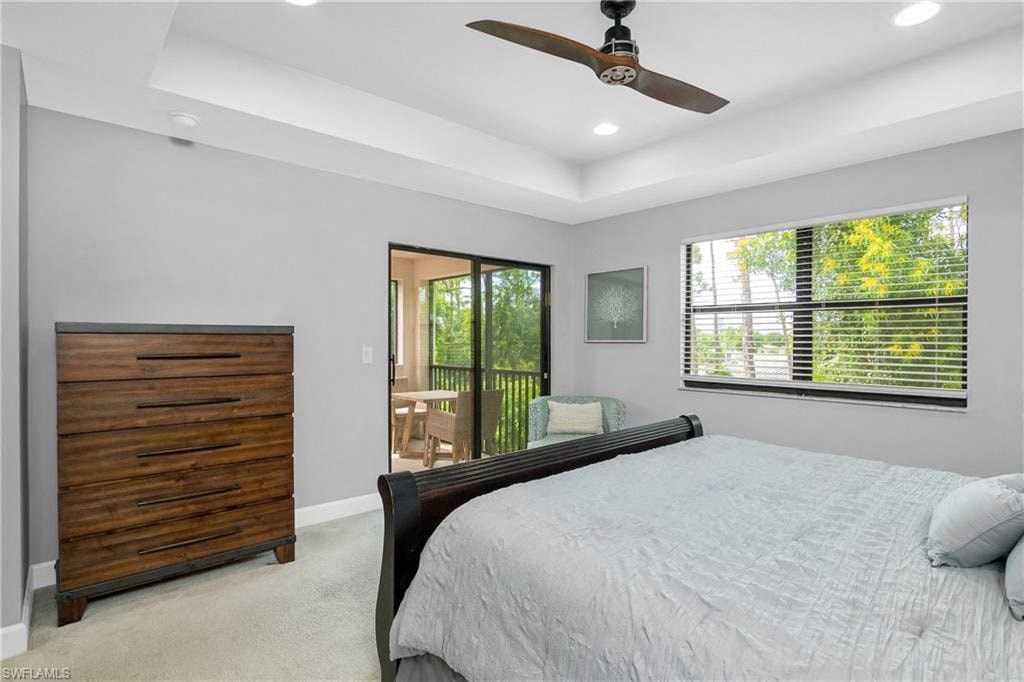 a bedroom with a bed and a ceiling fan