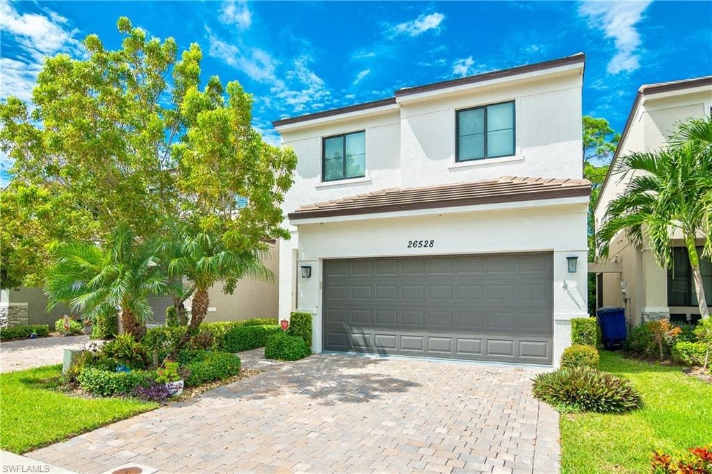 a house with a driveway and a garage door