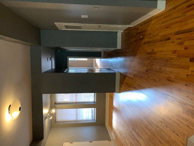 an overhead view of a loft with a wood floor