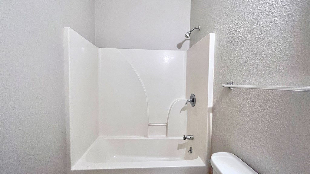 a small bathroom with a shower and a sink