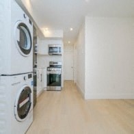 a laundry room with a washer and dryer in it