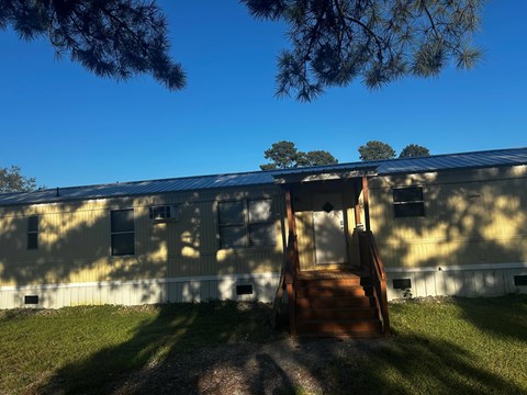 A building with a slide in front of it.