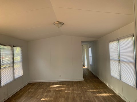 A room with wooden floors and white walls.