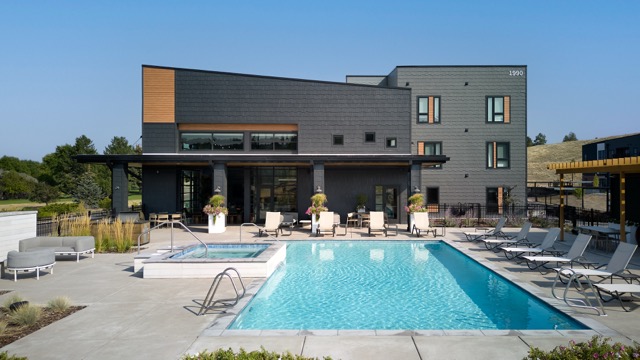 A modern house with a pool in the backyard.